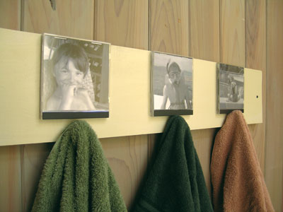 What better place to keep memories of those watery seaside vacations than with a bathroom photo gallery? This one just happens to lead a double life as a towel rack that encourages even the smallest family members to hang up their towels.